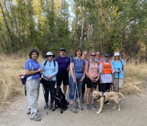 Jamie Harrell posing with a group of fellow athletes